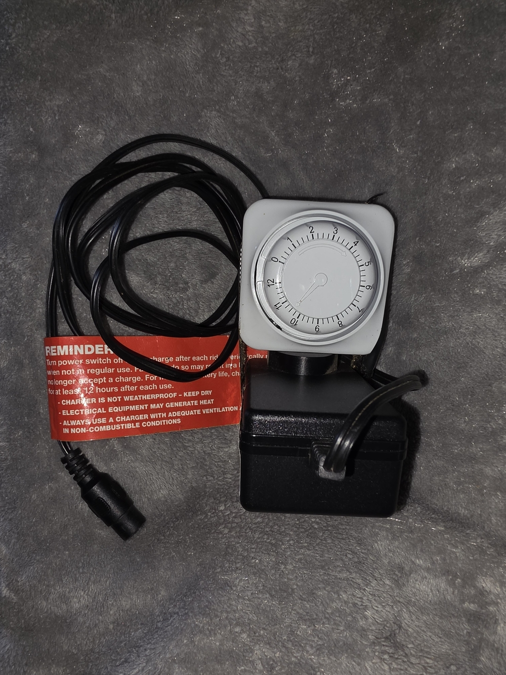 ^ Razor Scooter Power Charger with White Timer Dial